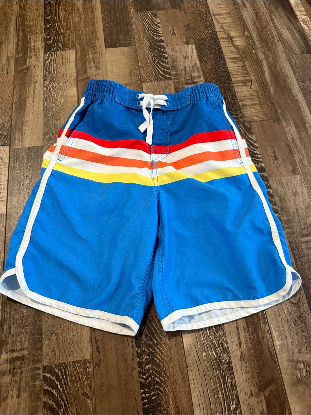 Hanna Andersson Bright Blue Swim Trunks with Red Orange Yellow Stripes